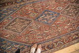 Persian Qashqai rug section: chestnut, sky blue herati patterns with early 20th century patina.