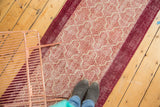 Distressed vintage Turkish Konya runner with Moroccan tile pattern in wine red and ivory.