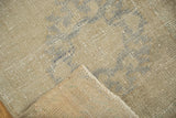 Oushak runner corner detail: visible hand-knotted pile, woven foundation, and finished side edge.
