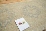 Hand-knotted wool pile and subtle multi-medallion pattern in antique ivory and silver grey.