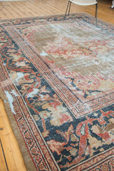 Distressed Antique Mahal carpet corner, showing navy border, terra cotta motifs, and faded pile.