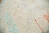 Decorative distressed Sivas carpet texture with blanched mint green and faded sand patterns.