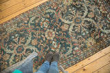 Distressed vintage Mahal runner featuring teal charcoal and terra cotta floral lattice.