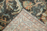 Vintage distressed Mahal rug corner with abstract pattern, short pile, visible foundation, and fringe.