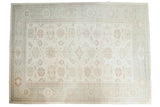 Hand-knotted Pakistani Sultanabad carpet, allover floral motifs in pastel ivory, seafoam green, terracotta.