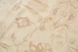 Delicate vinery and oversized floral arrangements in pastel shades on the ivory Sultanabad rug.