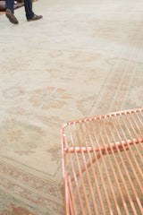 Pastel floral arrangements and delicate vinery on a vintage Pakistani Sultanabad design rug.