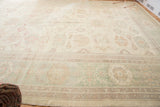 Sultanabad rug section with pastel floral vinery, abrash, and visible border pattern.