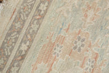 Pakistani Sultanabad carpet pile; delicate vinery and floral motifs in ivory, seafoam, terracotta.