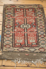 Vintage Oushak rug central geometric pattern, repeating diamond border, tattered end.