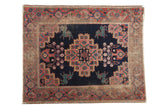 Distressed antique Afshar square rug with stepped medallion, mythological bunny motifs, indigo, red, and teal.