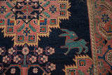Teal and red mythological 'bunny' creature on indigo field of an antique Afshar rug.