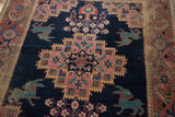 Antique Afshar rug: teal mythological creature motif and madder red geometric border.