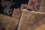 Hand-knotted foundation and mythological bunny motif on a distressed antique Afshar rug.