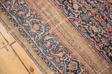 Intricate blush red, navy henna motif and aged dusty gold border on antique Farahan rug.