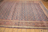 Antique Persian Farahan runner with an allover intricate henna plant motif, aged blush red and navy.