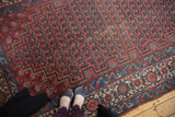 Antique Malayer runner's detailed boteh field and samovar border in bright red and navy blue.