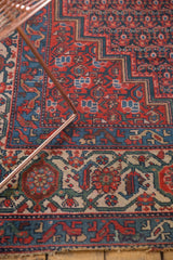 Antique Malayer runner detail: bright red boteh field, vine, and samovar border motifs.