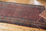 Antique Malayer rug's samovar main border with ivory, navy blue, and bright red boteh field.