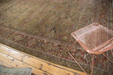 Antique Mahal runner's unusual dark moss green field with palmettes and ornate floral border.