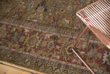 Hand-knotted antique Mahal rug border with moss green, copper, and gold floral motifs.