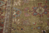 Antique Mahal runner's moss green field, low pile, and traditional floral motifs with narrow border.