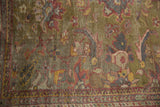 Antique Mahal rug: unusual moss green field with oversized copper, blue, gold palmettes and low pile.