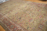 Antique Persian Mahal runner showing allover floral palmette design on moss green with copper borders.