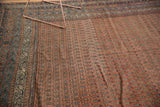 Antique Malayer runner detail: repeating Mir boteh field in brick red, blue, and ivory border.