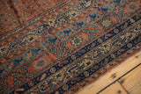 Secured edge of antique Malayer runner, showing Mir boteh motifs in brick red and blue.