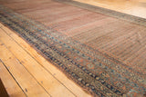 Antique Malayer runner featuring allover dusty brick red Mir boteh and navy blue, ivory borders.