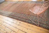 Navy blue borders and brick red Mir boteh pattern of the antique Malayer runner.