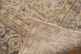 Distressed vintage Sivas carpet texture, revealing knot heads, foundation, and secure edge.