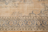Distressed Sivas carpet detail with dusty teal Islimis border and visible foundation.