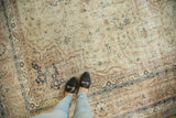 Vintage Distressed Sparta carpet, showcasing faded ivory, beige, and subtle navy curvilinear patterns.