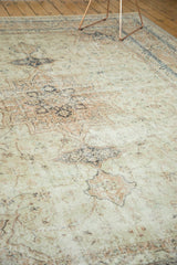 Distressed vintage Sparta rug pile featuring faded ivory, beige, and navy design.
