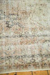 Vintage Distressed Sparta Carpet's worn pile texture, with faded ivory and beige.