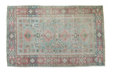 Distressed Turkish Sivas rug with quadruple medallion, faded sea foam green, and muted pink patterns.