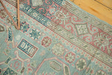 Distressed vintage Sivas rug with softened sea foam, raspberry, and ivory traditional patterns.