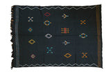 Jet black Moroccan Kilim rug with colorful geometric diamond embroidery and zig-zag borders, 6' x 9'.