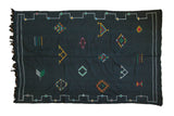 Hand woven jet black Moroccan Kilim with vibrant aqua, green, saffron shapes, 6' x 9'.