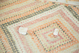 Distressed vintage Jijim carpet with two patch fill-ins, geometric stripes of tangerine, red, and ivory.