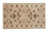 Distressed vintage Oushak rug with double rams horn medallions and floral motifs in chocolate brown and beige.