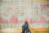 Vintage Distressed Oushak runner's texture with soft blush, blue, and gold abrashes.