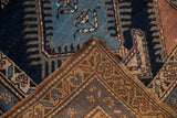 Hand-knotted reverse weave and geometric patterns on the pile of the Vintage Kurdish rug.