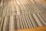 Vintage Moroccan Kilim patchwork with distinct horizontal bands, seams, ivory, brown tones.