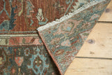 Corner detail of distressed vintage Malayer runner, with fringe and worn copper, teal leaf motifs.