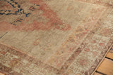 Distressed Oushak runner, highlighting low pile, abrashes, and foundation in faded rose and beige.