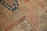 Distressed Oushak rug corner showing low pile, woven reverse, and original side cord selvage.