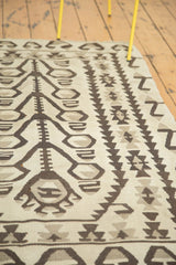 Distressed Kilim rug detail, geometric tree of life motif in charcoal, ivory, and silver.